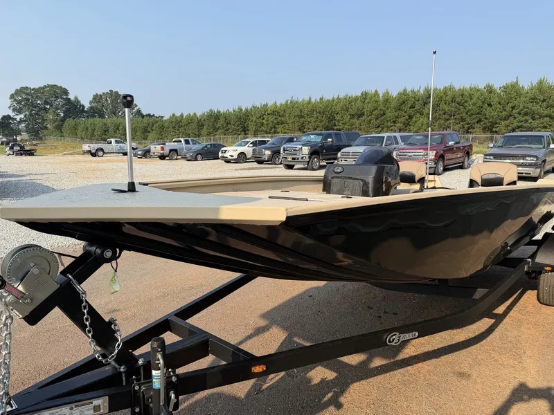 Slide: The Image of A G3 Gator Tough 18SC-90 SHO boat on a trailer, surrounded by cars and trees. - 4