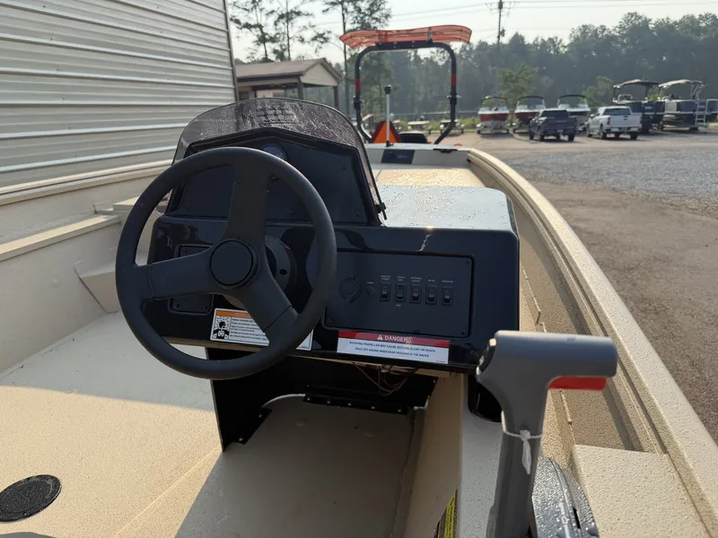 Slide: The Image of The image shows the helm of a 2027 G3 Gator Tough 18SC-90 SHO boat. - 6