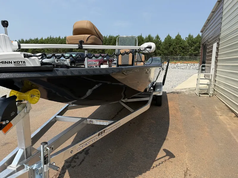 Slide: The Image of An Xpress Hyper-Lift Bay Series H24B-CUSTOM SEADECK from 2027 on a trailer next to a building. - 3