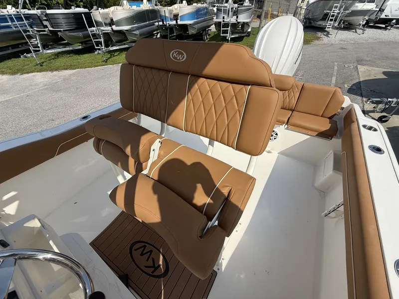 Slide: The Image of The image shows the cockpit of a Key West 239 FS boat with brown upholstery and a helm station. - 11