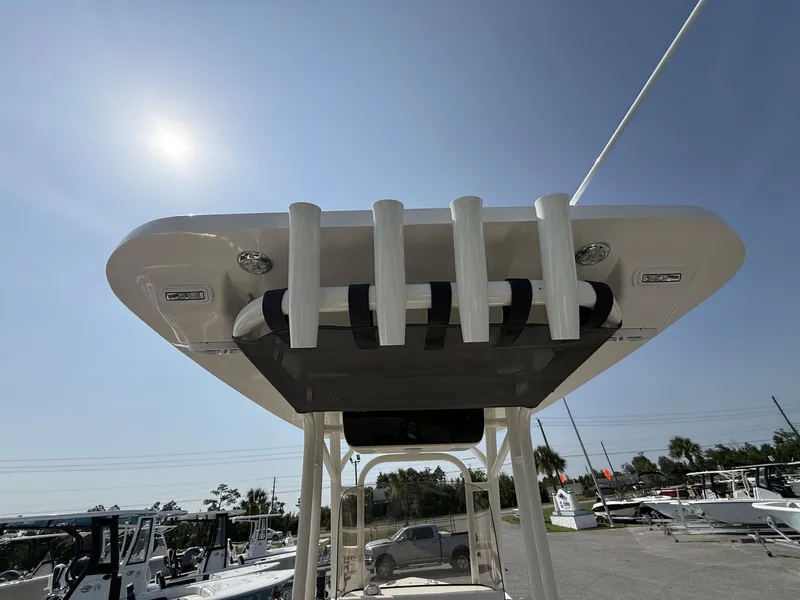 Slide: The Image of The image shows the T-top of a Key West 239 FS boat with rod holders. - 16