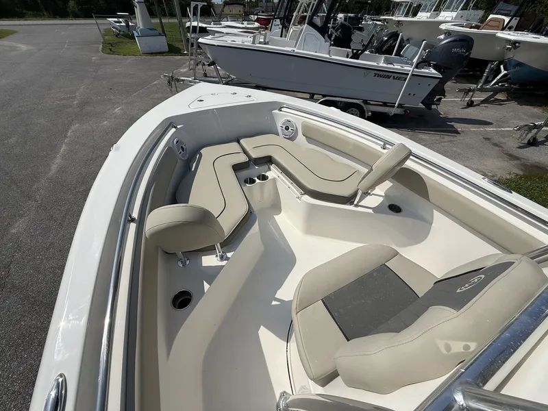 Slide: The Image of The image shows the cockpit of a Key West 203 FS boat with beige upholstery and modern seating. - 5