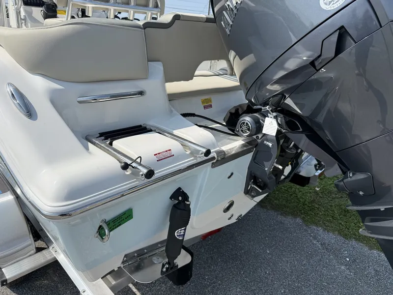 Slide: The Image of The image shows the stern of a Key West 203 FS boat with an outboard motor. - 7