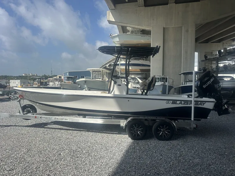 Slide: The Image of A 2026 Blazer PureBay 2400 sits on a trailer under a bridge. - 5