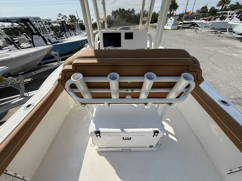 Slide: The Image of The image shows the cockpit of a Key West 239 FS boat with brown seats and rod holders. - 15