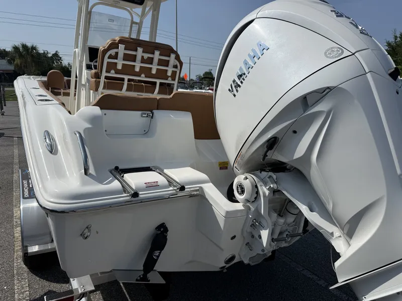 Slide: The Image of A Key West 239 FS boat with a Yamaha outboard motor, parked on a trailer. - 6
