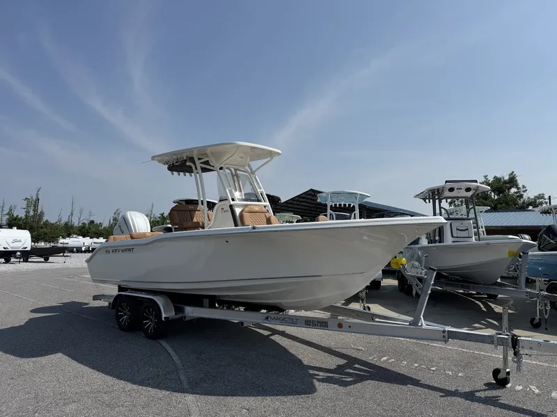 The Image of A 2027 Key West 239 FS boat on a trailer in a parking lot. - 1