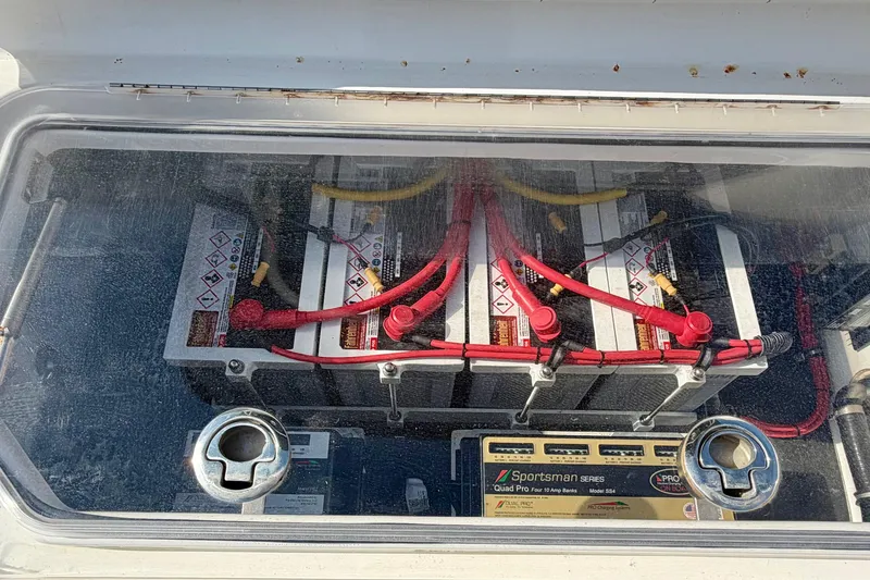 Slide: The Image of Battery compartment of a 2013 Nor-Tech 392 Super Fish boat with wiring and connections. - 30