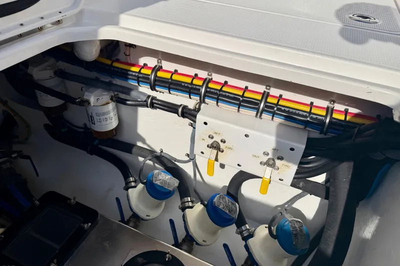 Slide: The Image of Engine compartment of a 2013 Nor-Tech 392 Super Fish boat, showing wiring and components. - 14