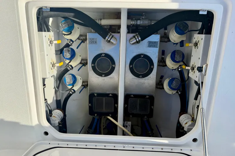 Slide: The Image of Engine compartment of a 2013 Nor-Tech 392 Super Fish boat, showcasing mechanical components. - 12