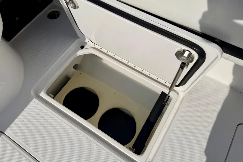 Slide: The Image of Open storage compartment on 2013 Nor-Tech 392 Super Fish boat deck. - 15