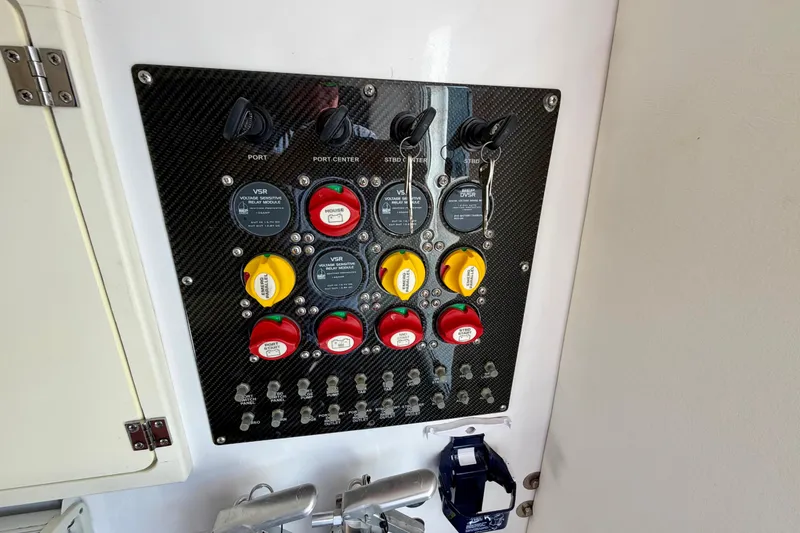 Slide: The Image of Control panel of a 2013 Nor-Tech 392 Super Fish boat with switches and indicators. - 33