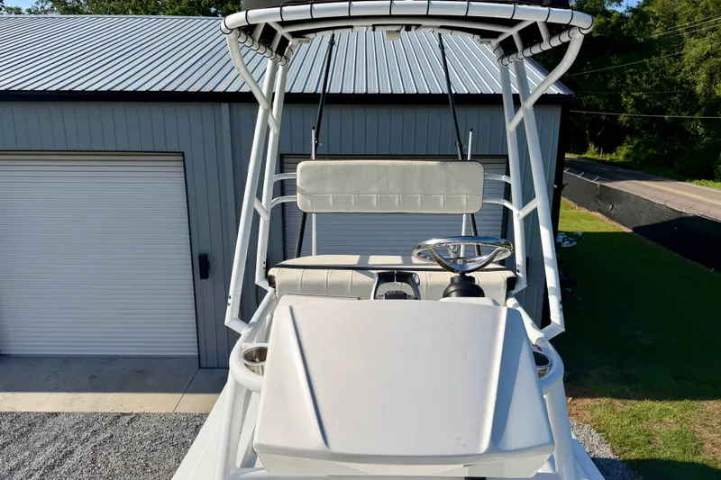 Slide: The Image of 2013 Nor-Tech 392 Super Fish boat helm with T-top and steering wheel. - 40