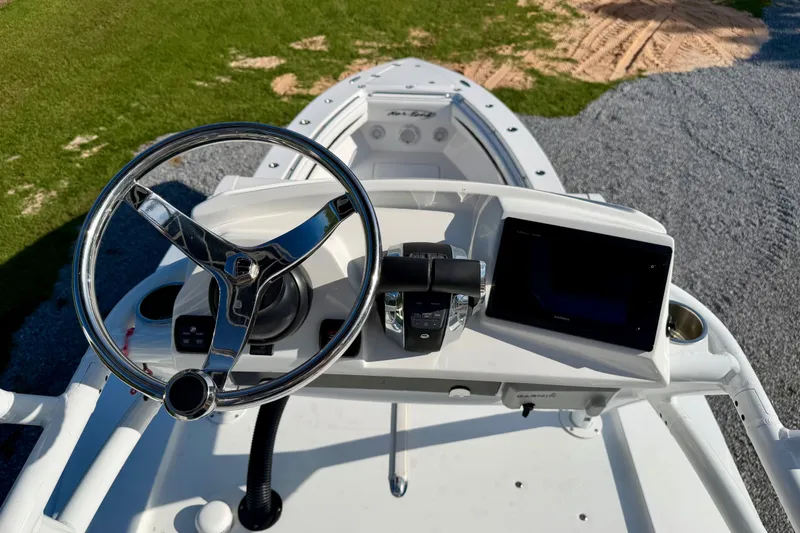 Slide: The Image of Steering console of 2013 Nor-Tech 392 Super Fish boat with modern controls and display. - 37