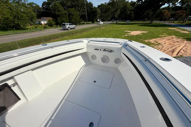 Slide: The Image of 2013 Nor-Tech 392 Super Fish boat interior with sleek white design and spacious seating. - 25