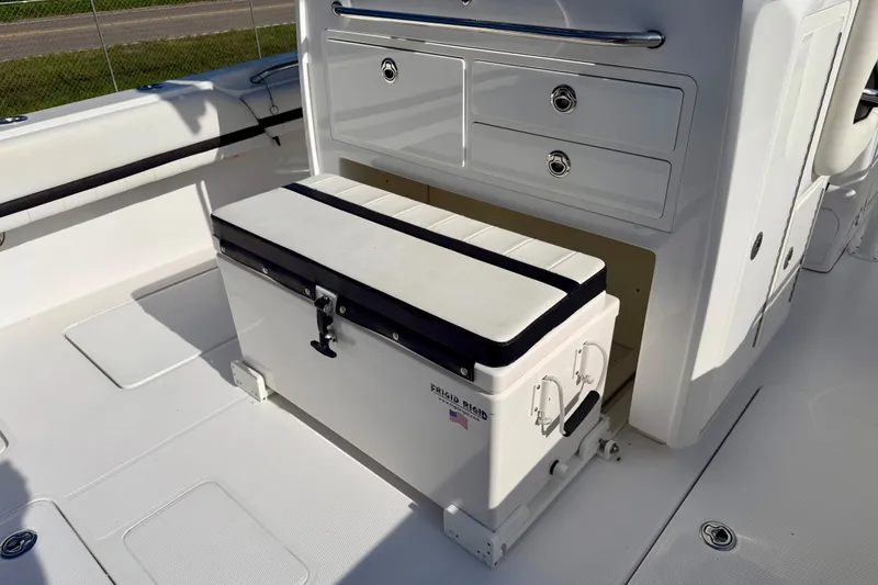 Slide: The Image of 2013 Nor-Tech 392 Super Fish boat interior with storage and seating area. - 11