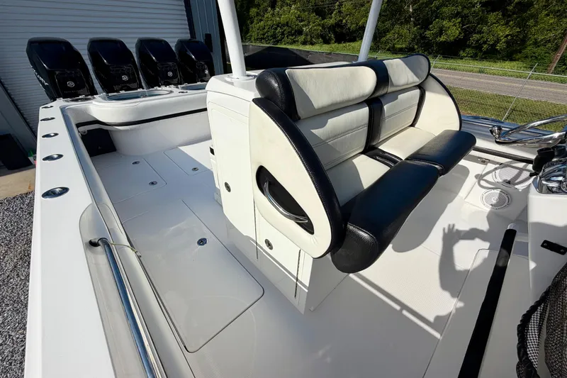 Slide: The Image of 2013 Nor-Tech 392 Super Fish boat interior with seating and multiple outboard engines. - 22