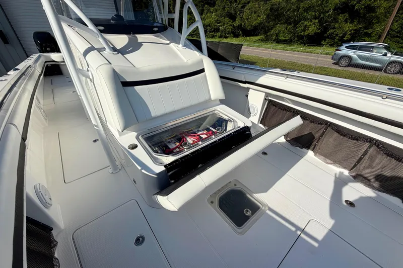 Slide: The Image of 2013 Nor-Tech 392 Super Fish boat interior with storage compartment open, showcasing sleek design. - 31