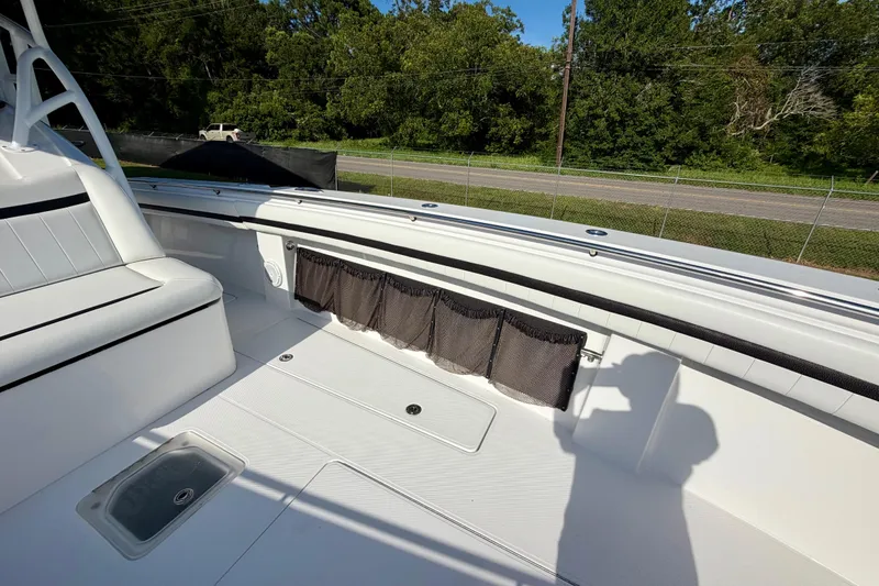 Slide: The Image of 2013 Nor-Tech 392 Super Fish boat interior with seating and storage compartments. - 29