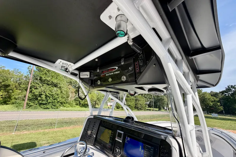 Slide: The Image of 2013 Nor-Tech 392 Super Fish boat dashboard with advanced navigation equipment. - 24
