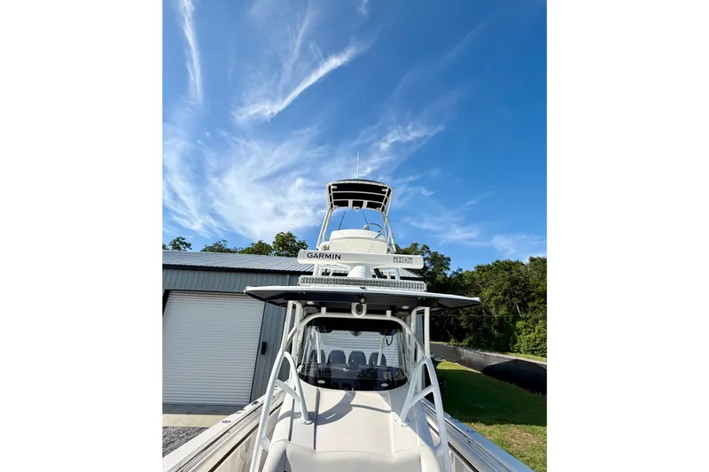 Slide: The Image of 2013 Nor-Tech 392 Super Fish boat with Garmin equipment under a clear blue sky. - 26