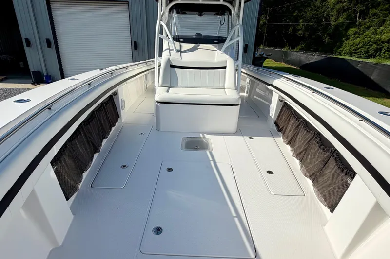 Slide: The Image of 2013 Nor-Tech 392 Super Fish boat interior with spacious deck and seating. - 28