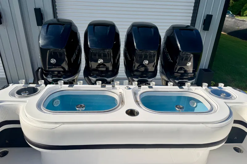 Slide: The Image of 2013 Nor-Tech 392 Super Fish boat with four powerful outboard engines and dual livewells. - 6