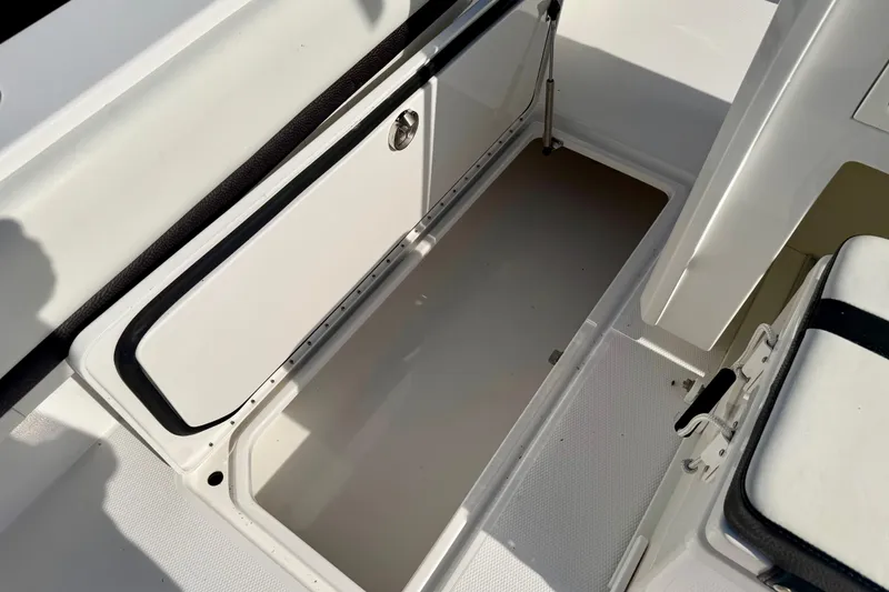 Slide: The Image of Open storage compartment on 2013 Nor-Tech 392 Super Fish boat, showcasing interior space. - 16