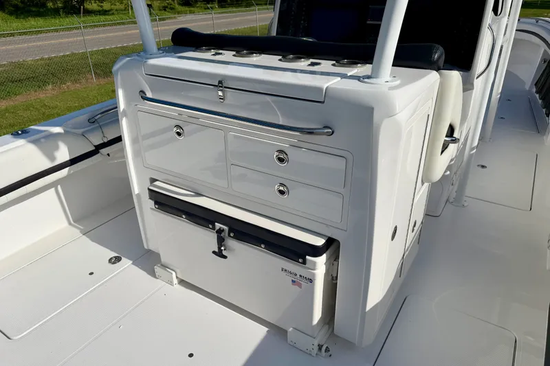 Slide: The Image of 2013 Nor-Tech 392 Super Fish boat interior with storage compartments and seating. - 8