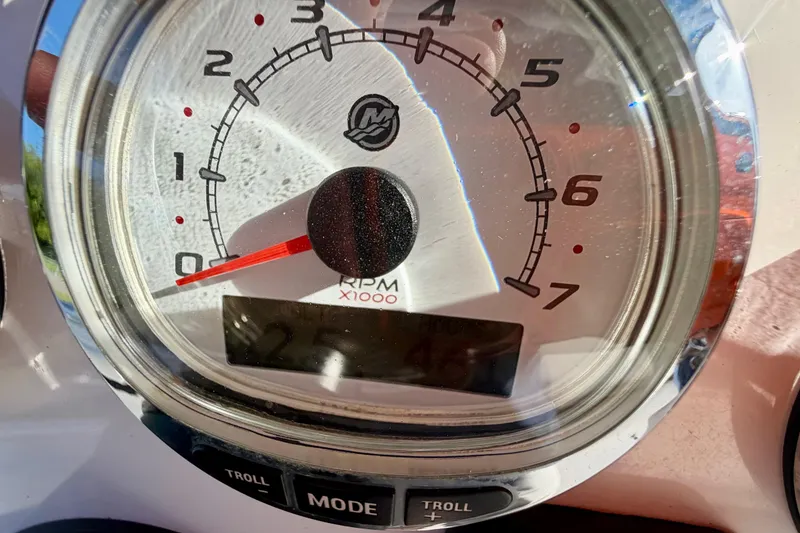 Slide: The Image of Close-up of a 2013 Nor-Tech 392 Super Fish tachometer displaying RPM. - 20