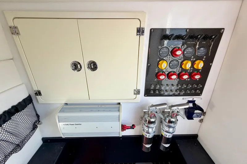 Slide: The Image of Control panel and storage on a 2013 Nor-Tech 392 Super Fish boat. - 34