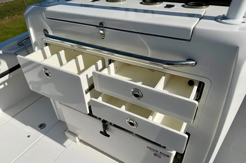 Slide: The Image of Open storage drawers on a 2013 Nor-Tech 392 Super Fish boat, showcasing ample space. - 10