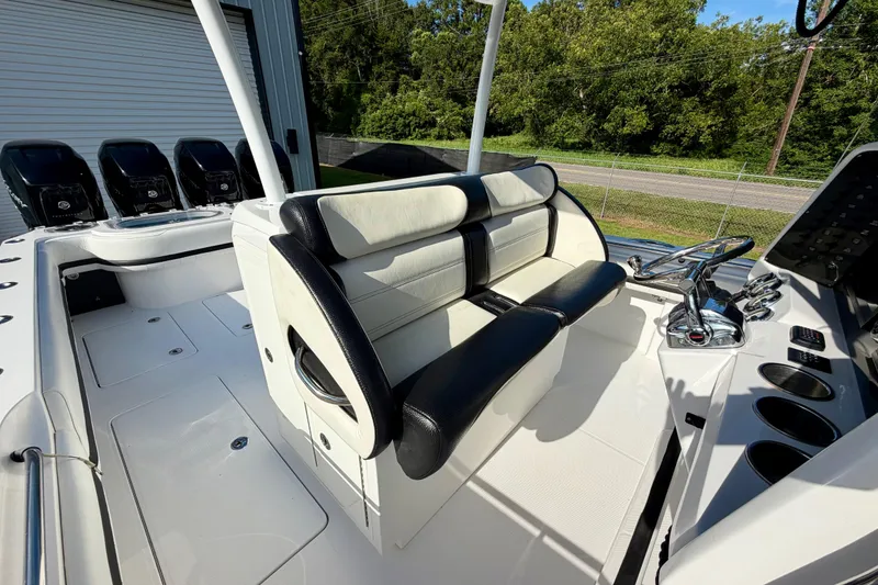 Slide: The Image of 2013 Nor-Tech 392 Super Fish boat interior with seating and control panel. - 21