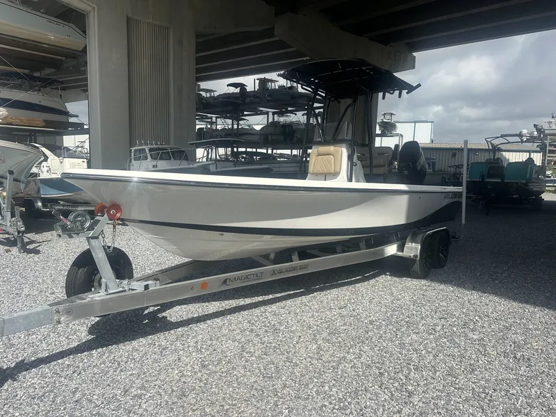 Slide: The Image of A 2026 Blazer PureBay 2400 sits on a trailer under a covered area. - 4