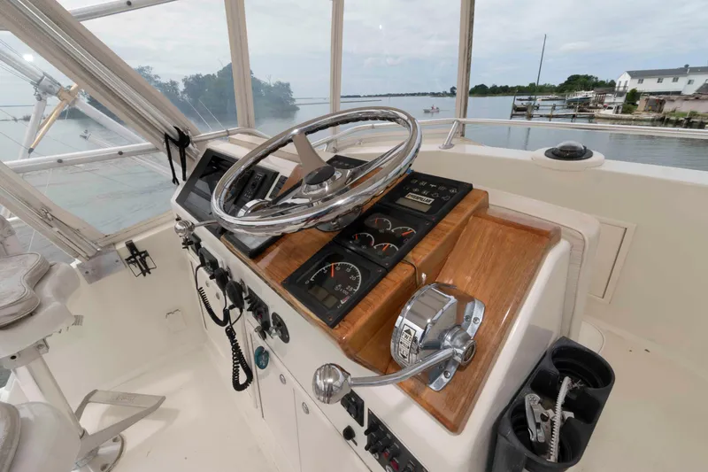 Slide: The Image of Helm of 1970 Hatteras 45 Convertible yacht with steering wheel and control panel. - 7