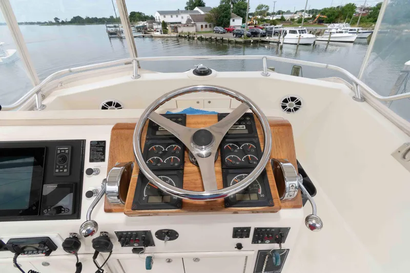 Slide: The Image of Helm of 1970 Hatteras 45 Convertible yacht with gauges and steering wheel. - 9