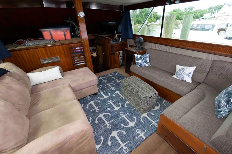 Slide: The Image of Interior of 1970 Hatteras 45 Convertible yacht with cozy seating and nautical-themed decor. - 13