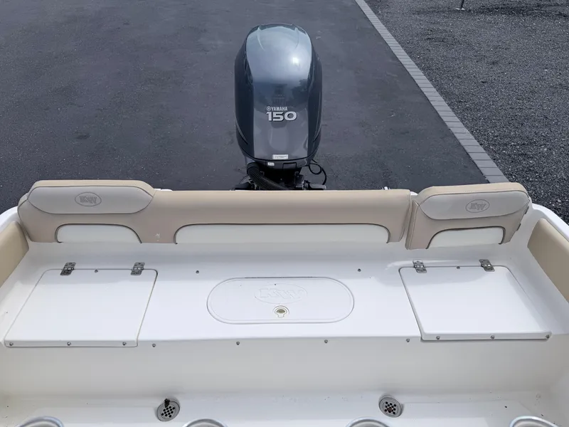 Slide: The Image of The image shows the stern of a 2014 Key West 219 FS boat with a Yamaha 150 engine. - 24