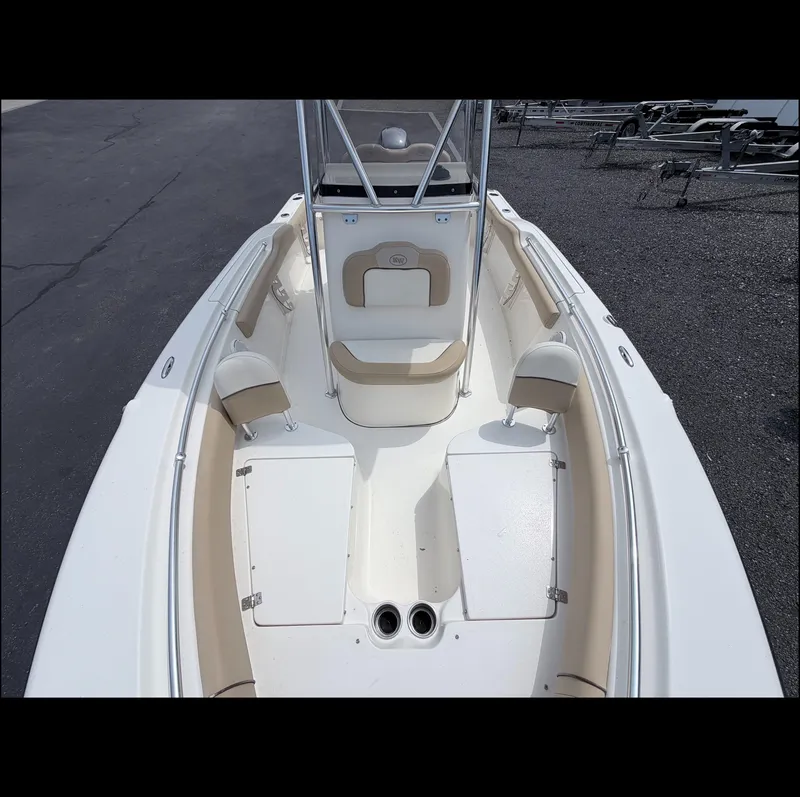 Slide: The Image of The image shows the bow of a 2014 Key West 219 FS boat with beige upholstery. - 8
