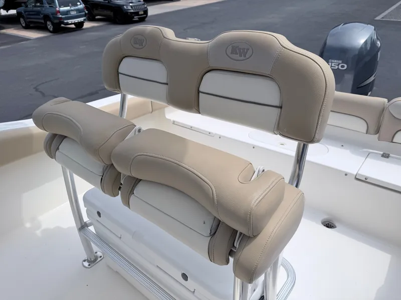 Slide: The Image of The image shows beige cushioned seats on a 2014 Key West 219 FS boat. - 20