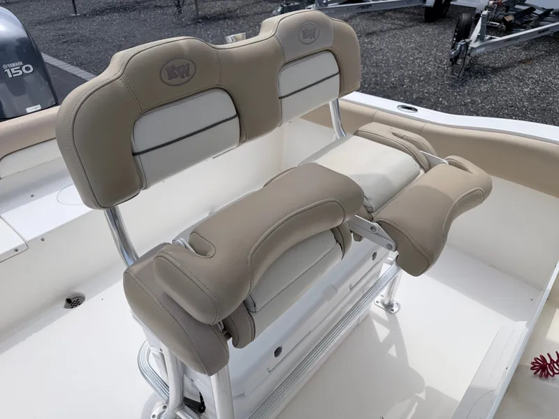 Slide: The Image of The image shows the beige upholstery of the seating on a Key West 219 FS boat. - 18