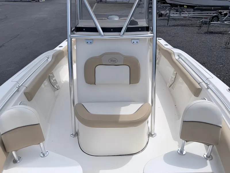 Slide: The Image of The image shows the bow of a Key West 219 FS boat with beige upholstery. - 10