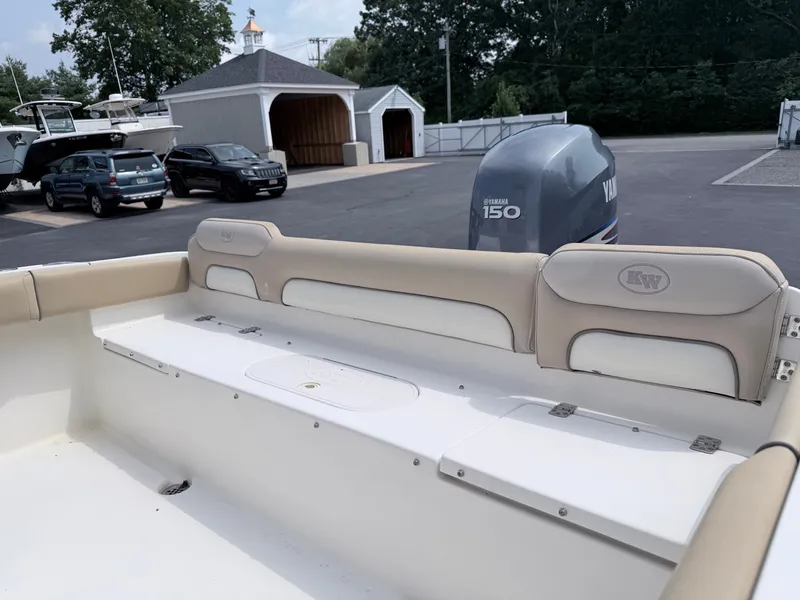 Slide: The Image of The image shows the stern of a 2014 Key West 219 FS boat with a Yamaha 150 engine. - 21