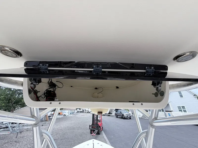 Slide: The Image of The image shows the T-top of a Key West 219 FS boat with mounted lights. - 15