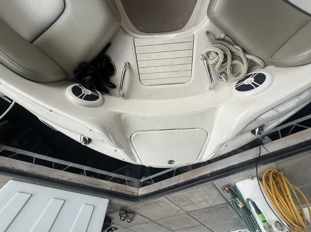 Slide: The Image of The image shows the deck of a 2006 Sea Ray 240 Sundeck with speakers and ropes. - 11