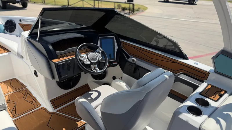 Slide: The Image of The image shows the cockpit of a 2021 Tigé Z3 boat with modern design and helm console. - 12