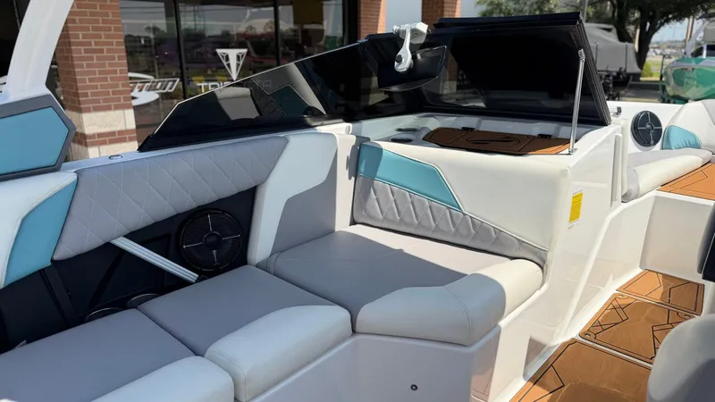 Slide: The Image of The image shows the interior of a 2021 Tigé Z3 boat with modern seating and stylish design. - 11