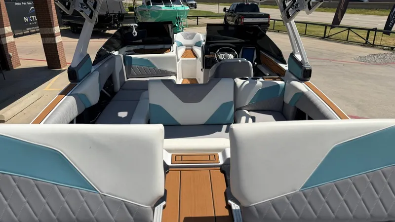 Slide: The Image of The image shows the interior of a 2021 Tigé Z3 boat with modern seating and sleek design. - 10