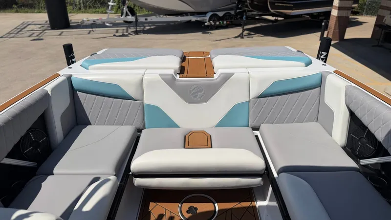 Slide: The Image of The image shows the cockpit of a 2021 Tigé Z3 boat with stylish, upholstered seating. - 15