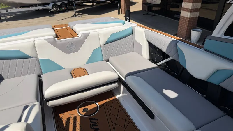 Slide: The Image of The image shows the interior of a 2021 Tigé Z3 boat with stylish seating. - 16